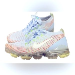 Baby blue, lime green, and orange tennis shoes